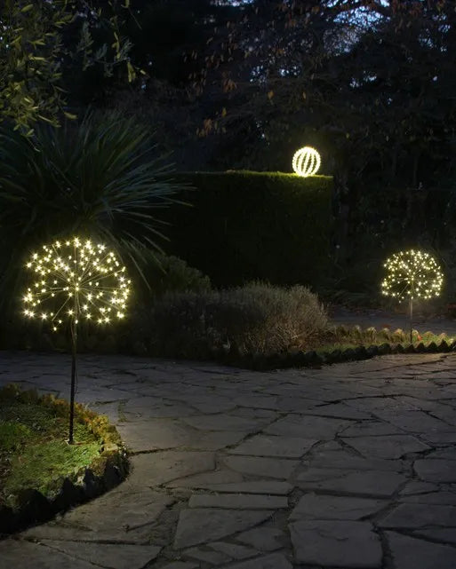 Dandelion solar lights lighting a garden path at night