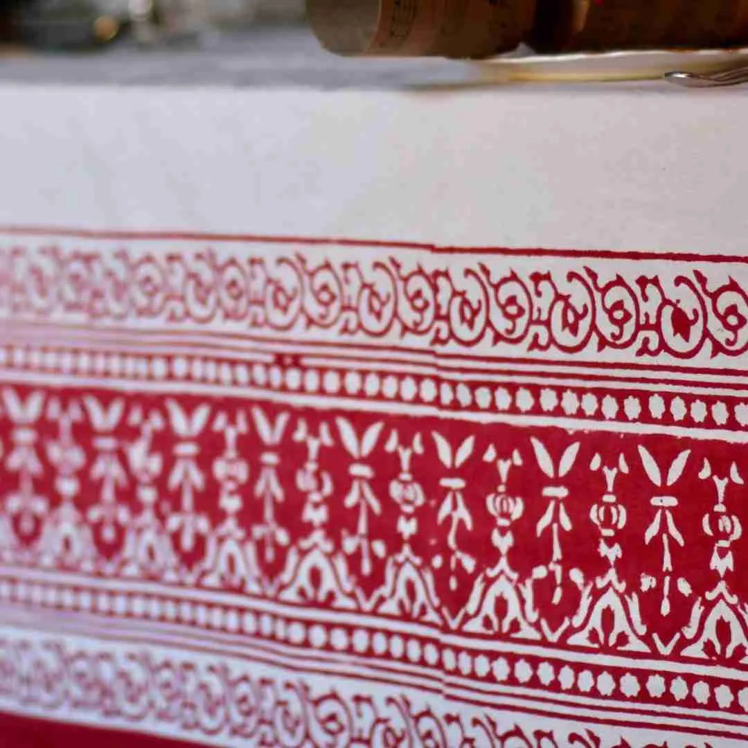 Close-up of the Ruby Garland tablecloth's red and white block printed border