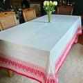 Ruby Garland block printed tablecloth on a dining table with wicker chairs
