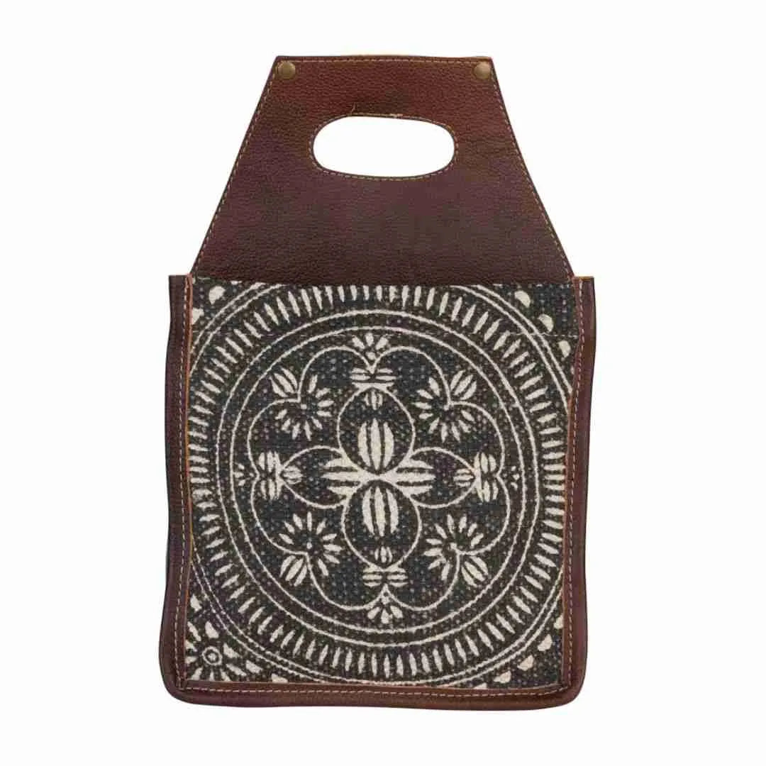Front of the tapestry beer caddy with its cream and brown medallion pattern