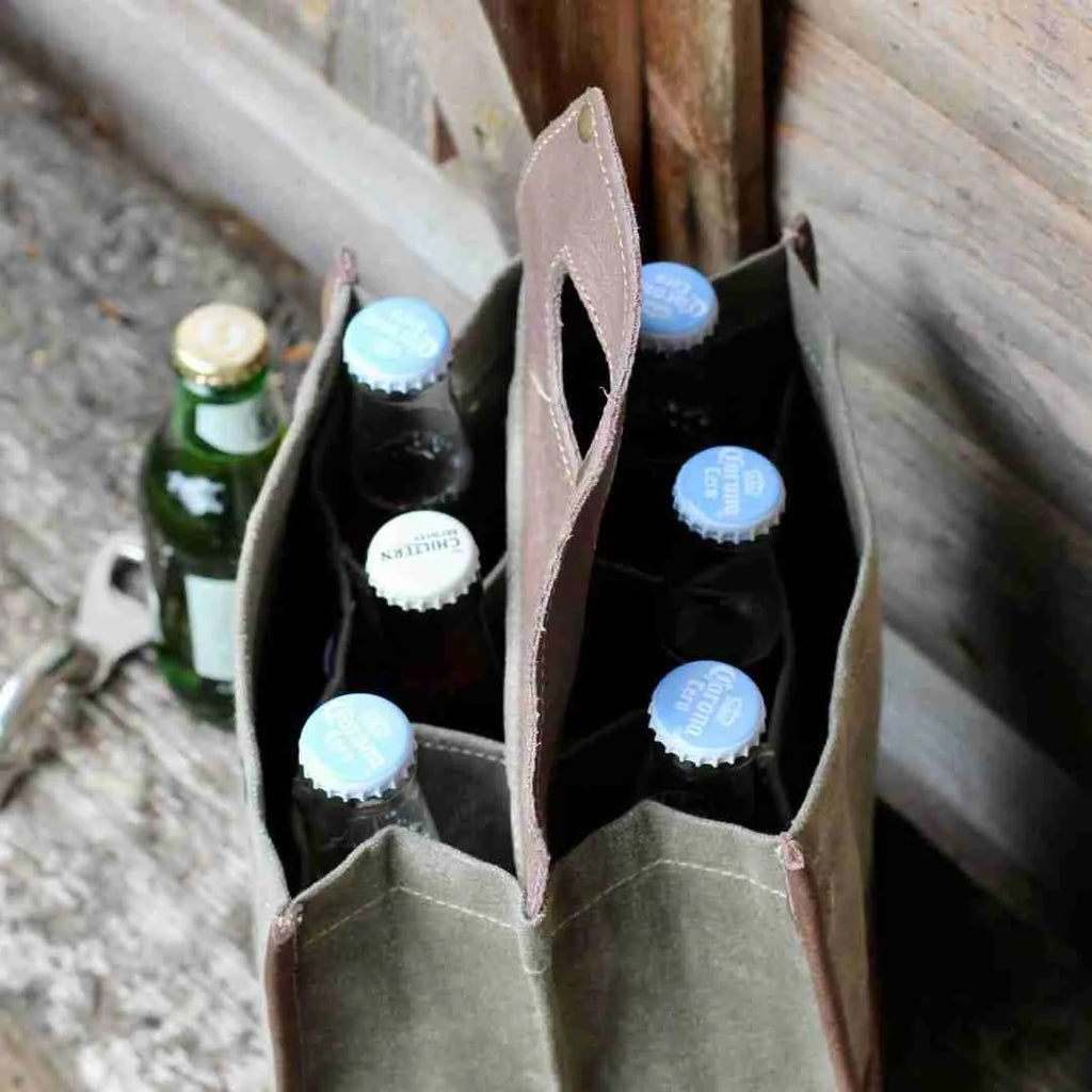 Inside the canvas beer caddy, holding six bottles