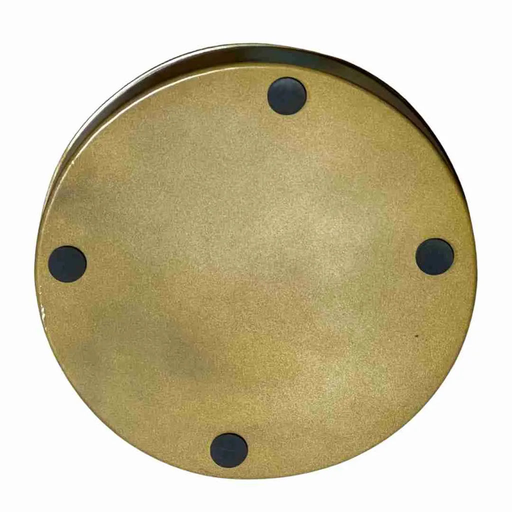 Underside of the round camel tray in gold with four black feet