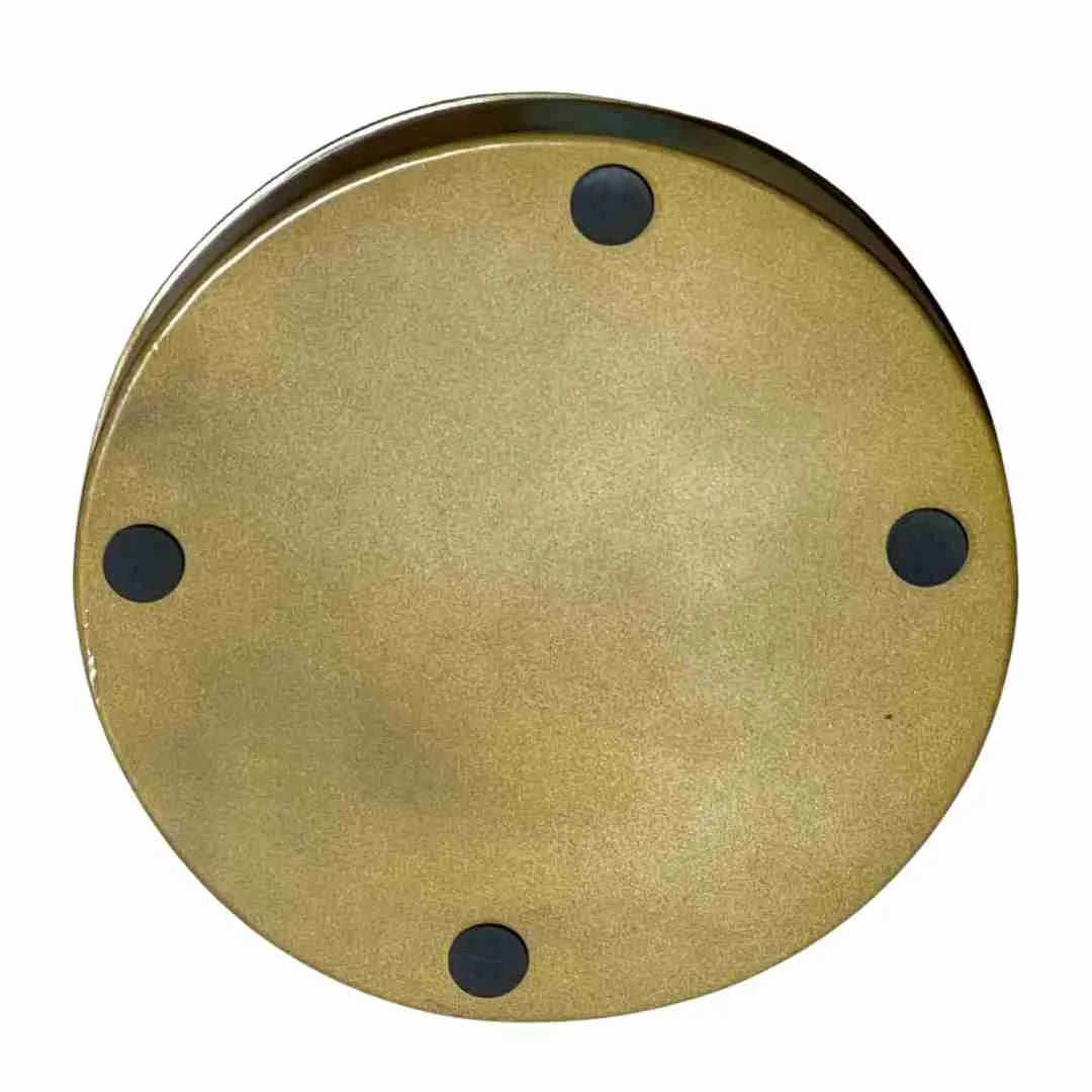 Underside of the round camel tray in gold with four black feet