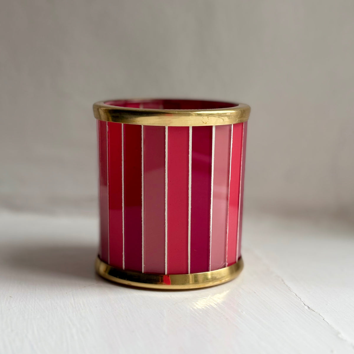 Strawberry Fizz pink striped glass tealight holder with a brass rim