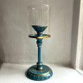 Harlequin hand-enamelled brass hurricane candle holder in Denim Blue with a glass sleeve