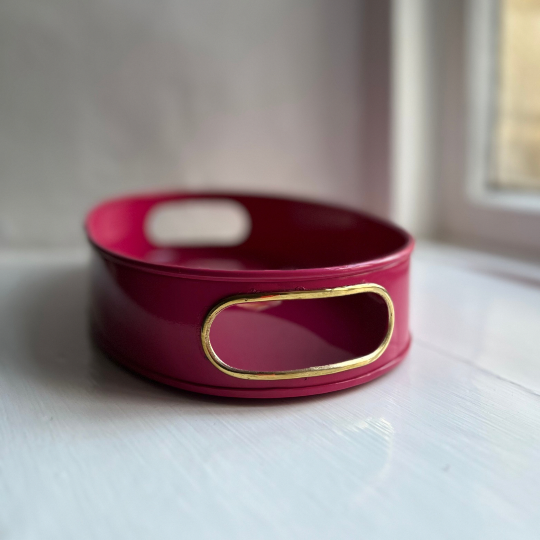 Flamingo small oval tray in raspberry pink enamel and brass showing the cut-out handles