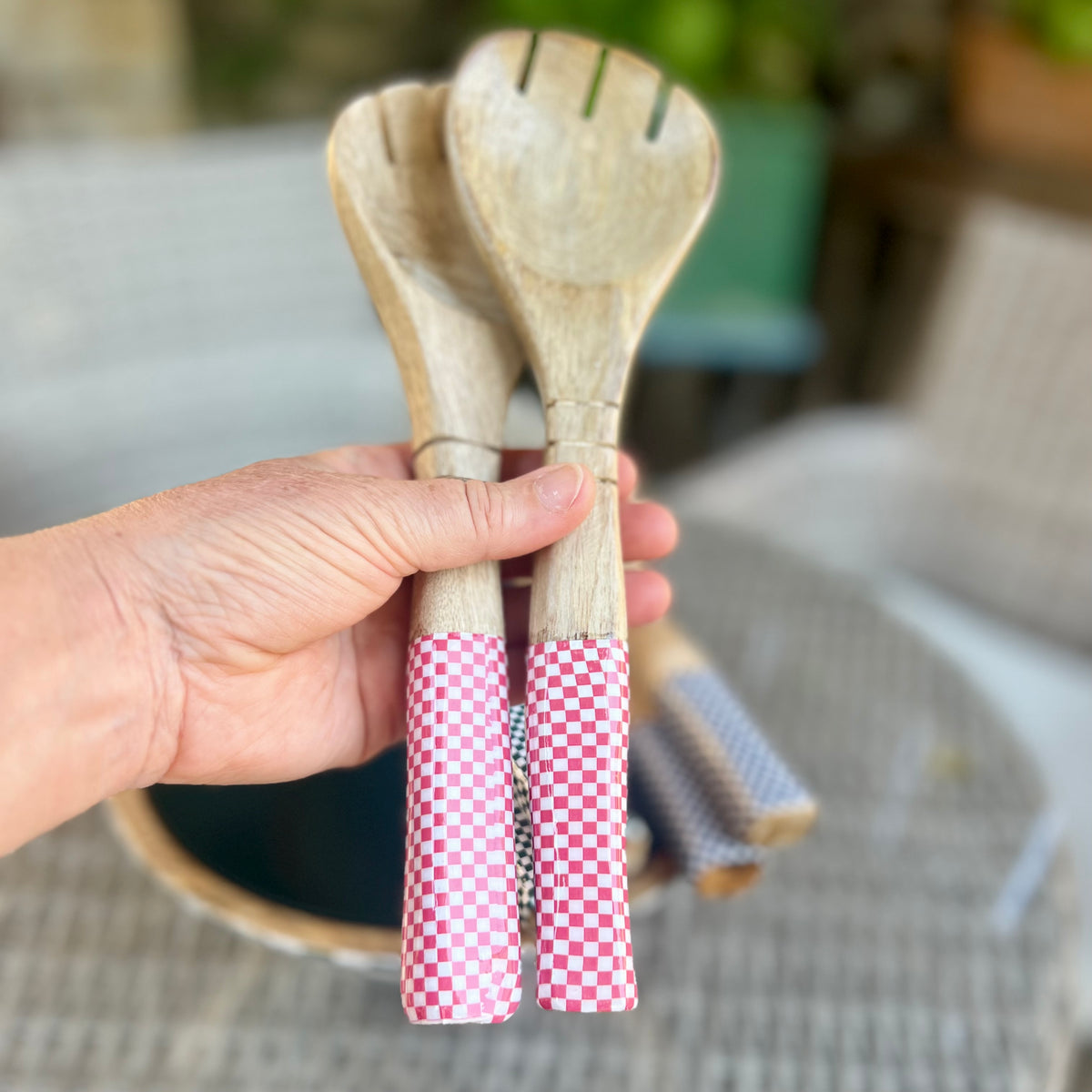 Wooden salad servers with pink checked enamel handles
