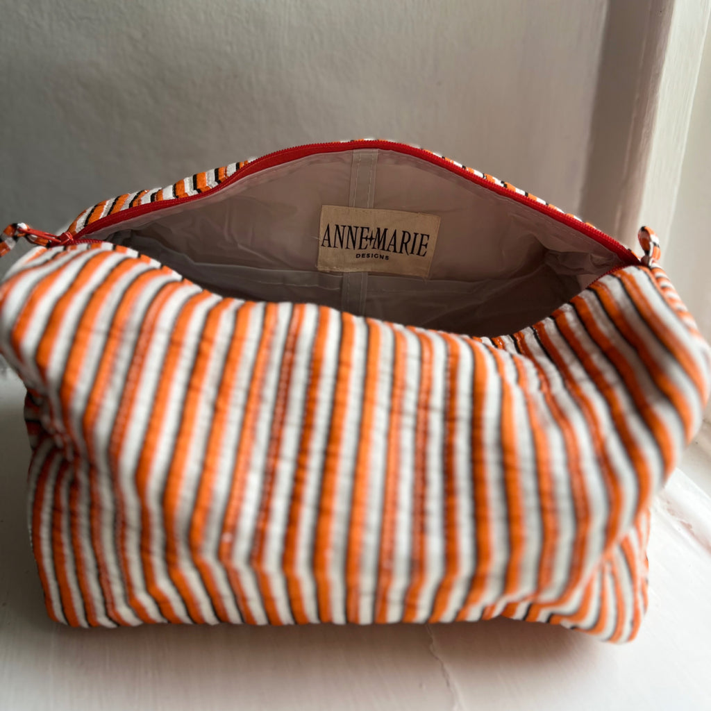 Inside the orange stripe Harlequin washbag, showing the lining