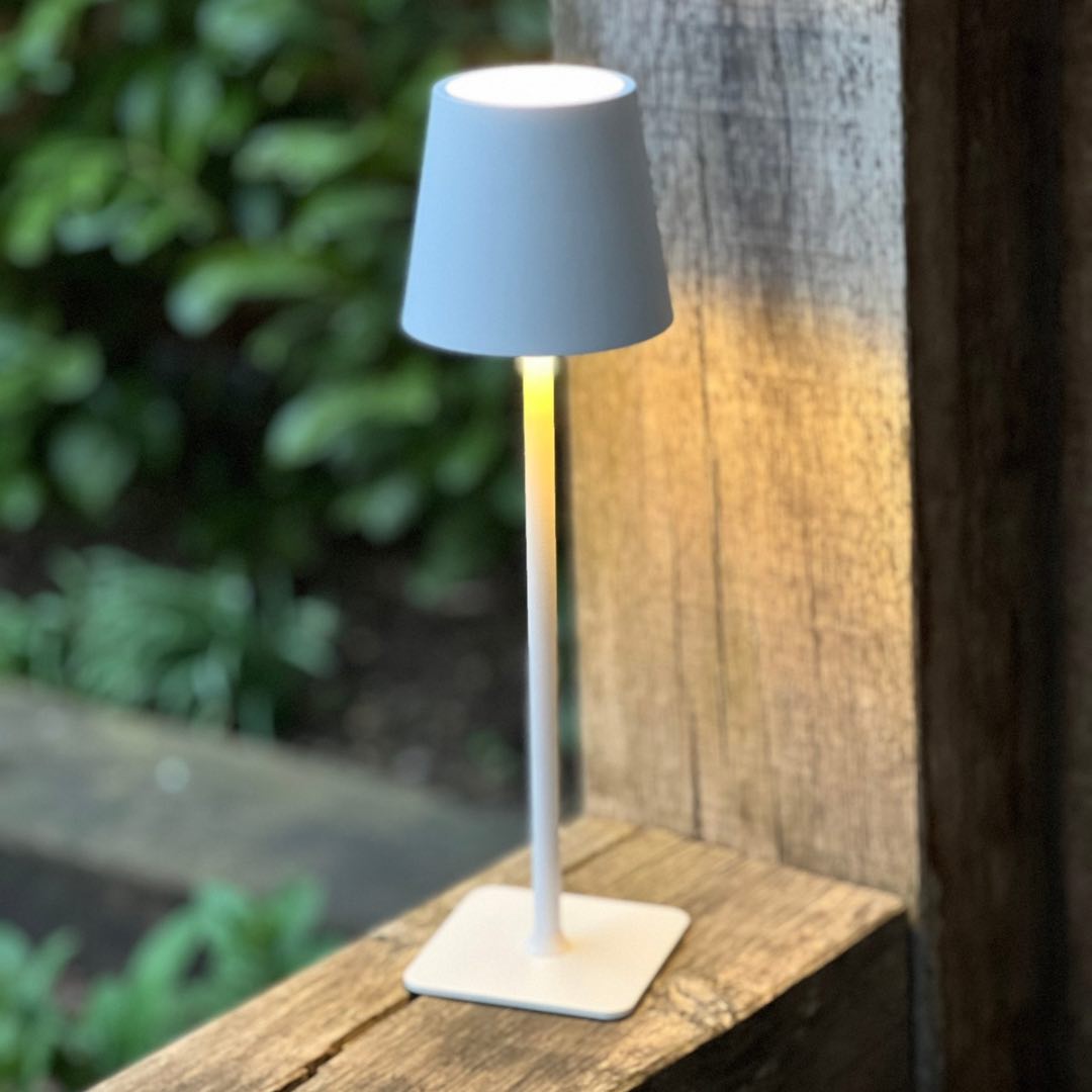 White LED cordless lamp switched on outdoors