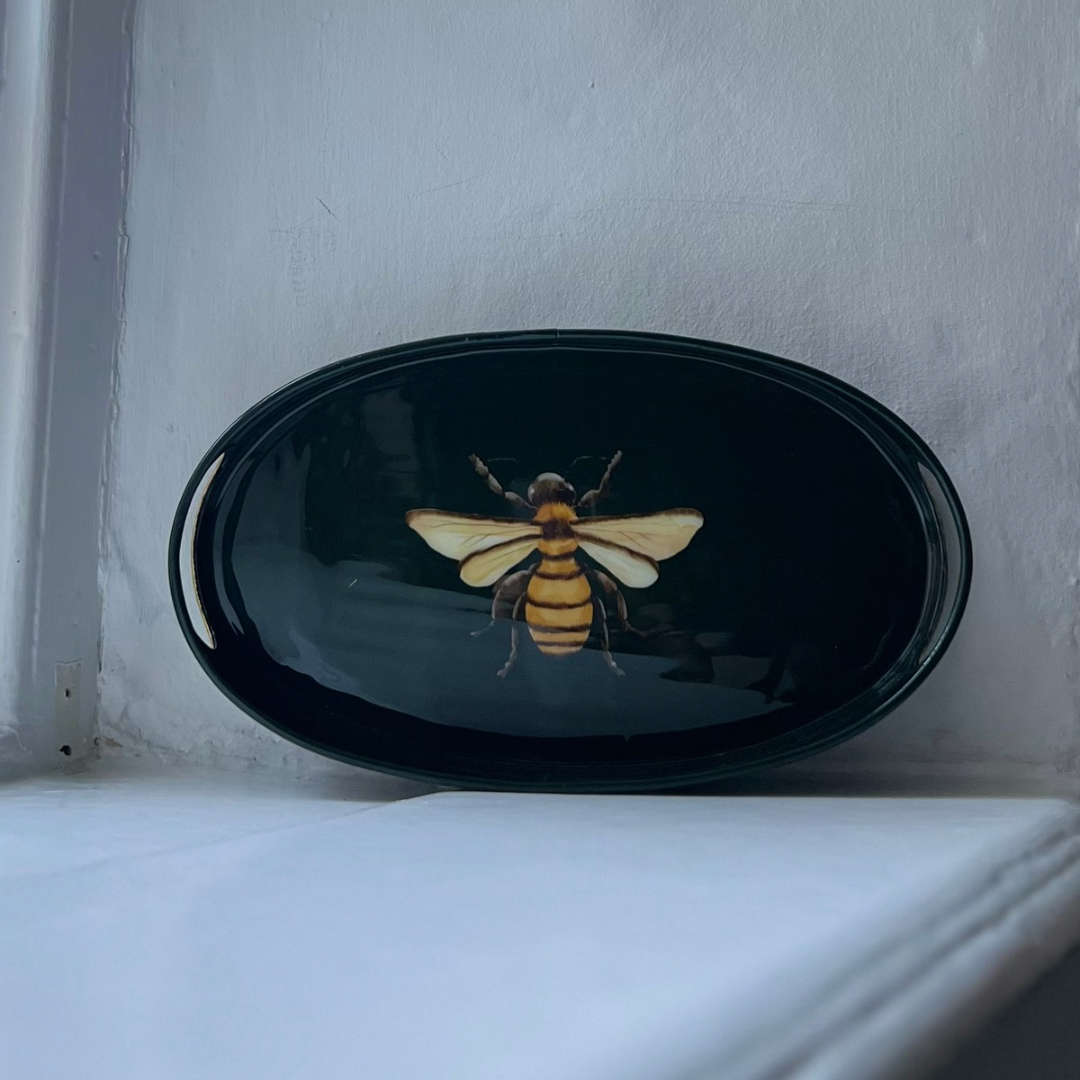 Honeybee small oval tray in dark green enamel and brass, top view
