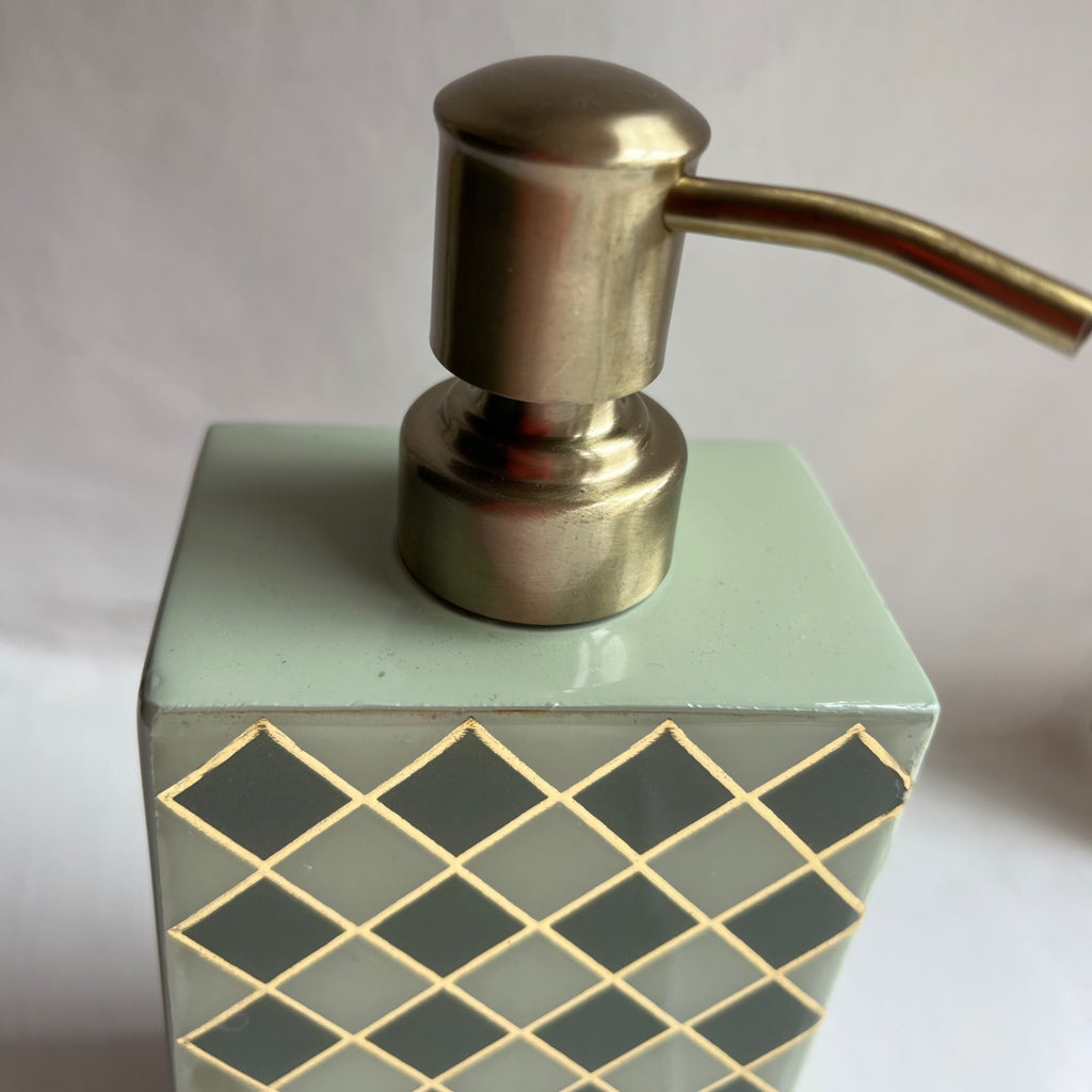 Harlequin enamel and brass multi-use bottle in Sage Green, close-up of the brass pump