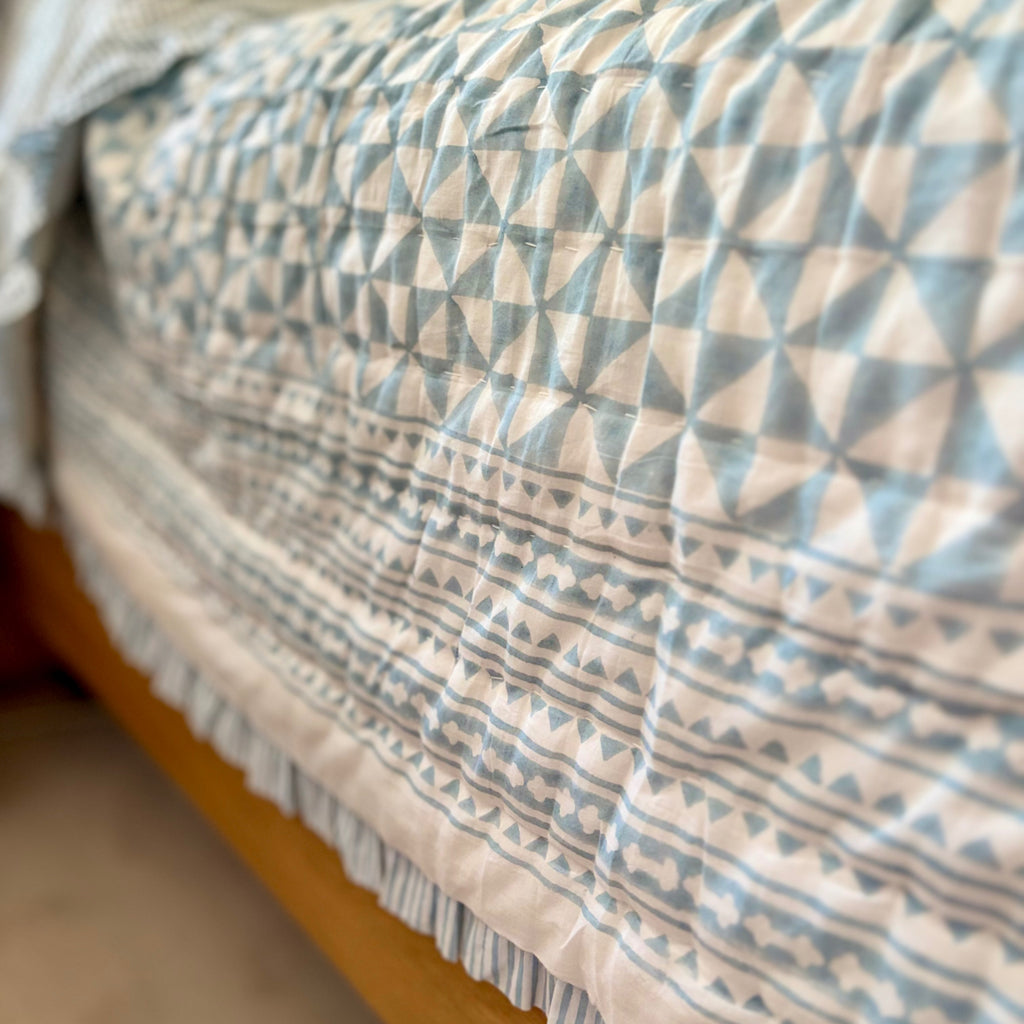 Harlequin reversible cotton quilt in Sea Breeze Blue, edge detail