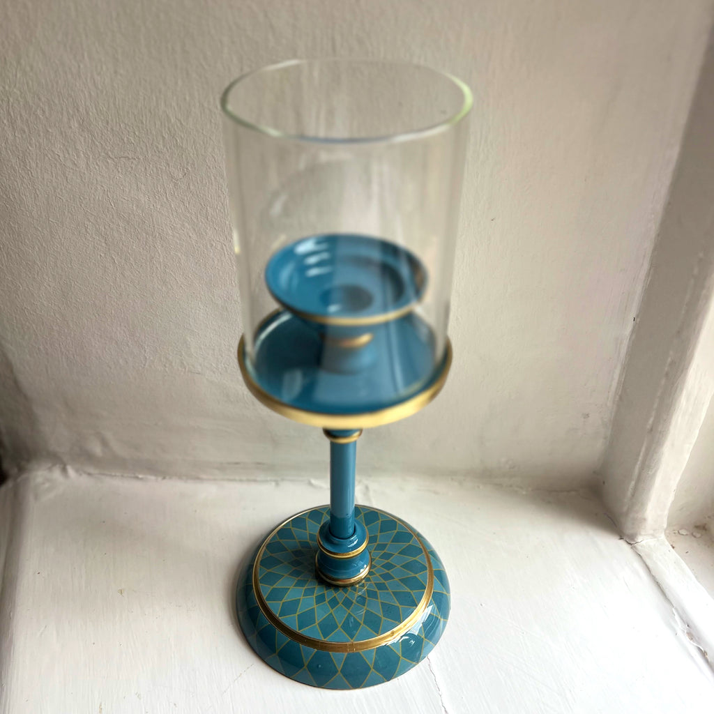 Harlequin hand-enamelled brass hurricane candle holder in Denim Blue, glass sleeve viewed from above