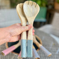 Wooden salad servers with green checked enamel handles