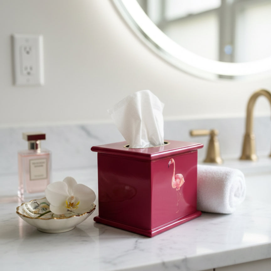 Flamingo square tissue box in raspberry pink enamel and brass on a bathroom counter