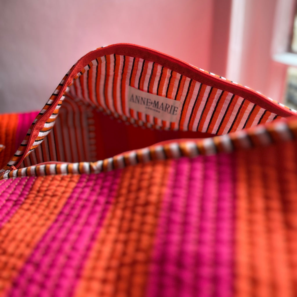 Inside the orange and pink Harlequin weekend bag