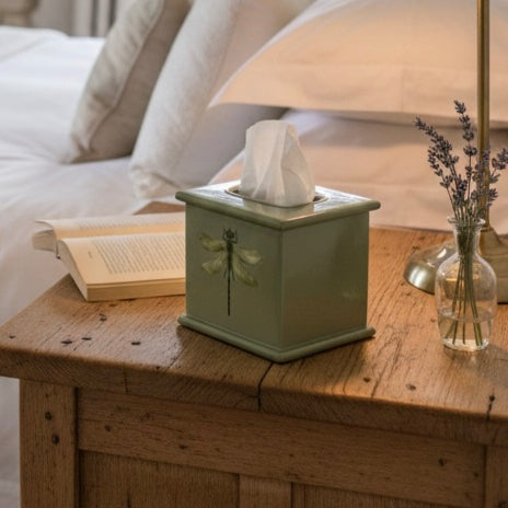 Dragonfly square tissue box in sage green enamel and brass on a wooden dresser