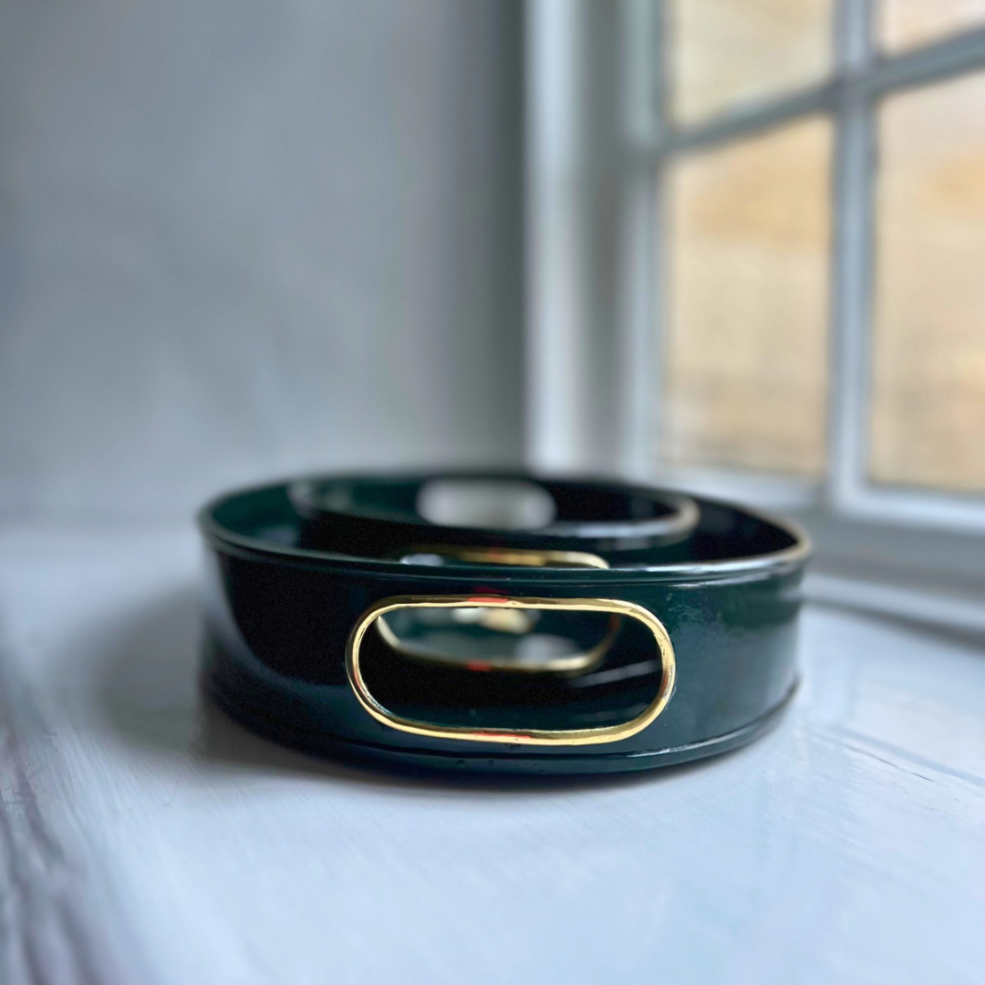 Honeybee small oval tray in dark green enamel and brass showing the cut-out handles
