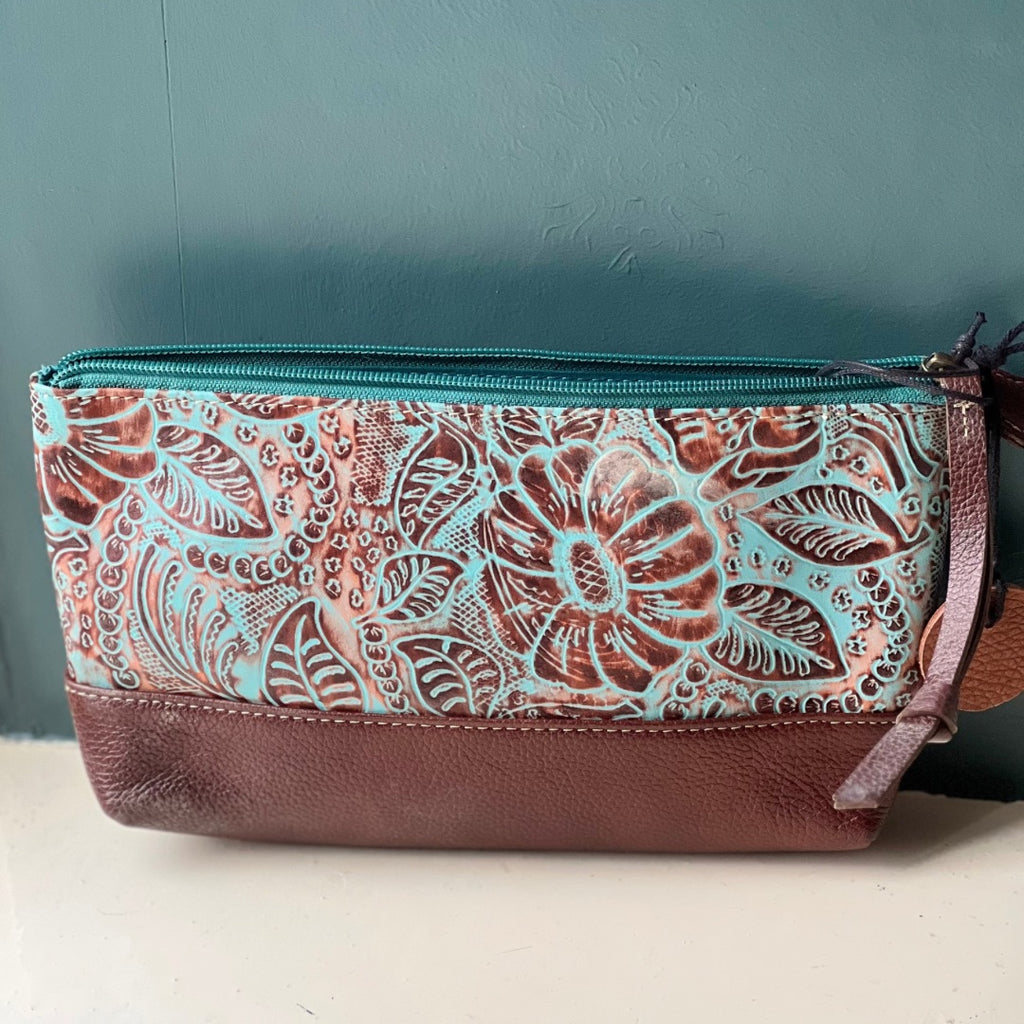 Turquoise leather clutch bag with a zip and leather pull