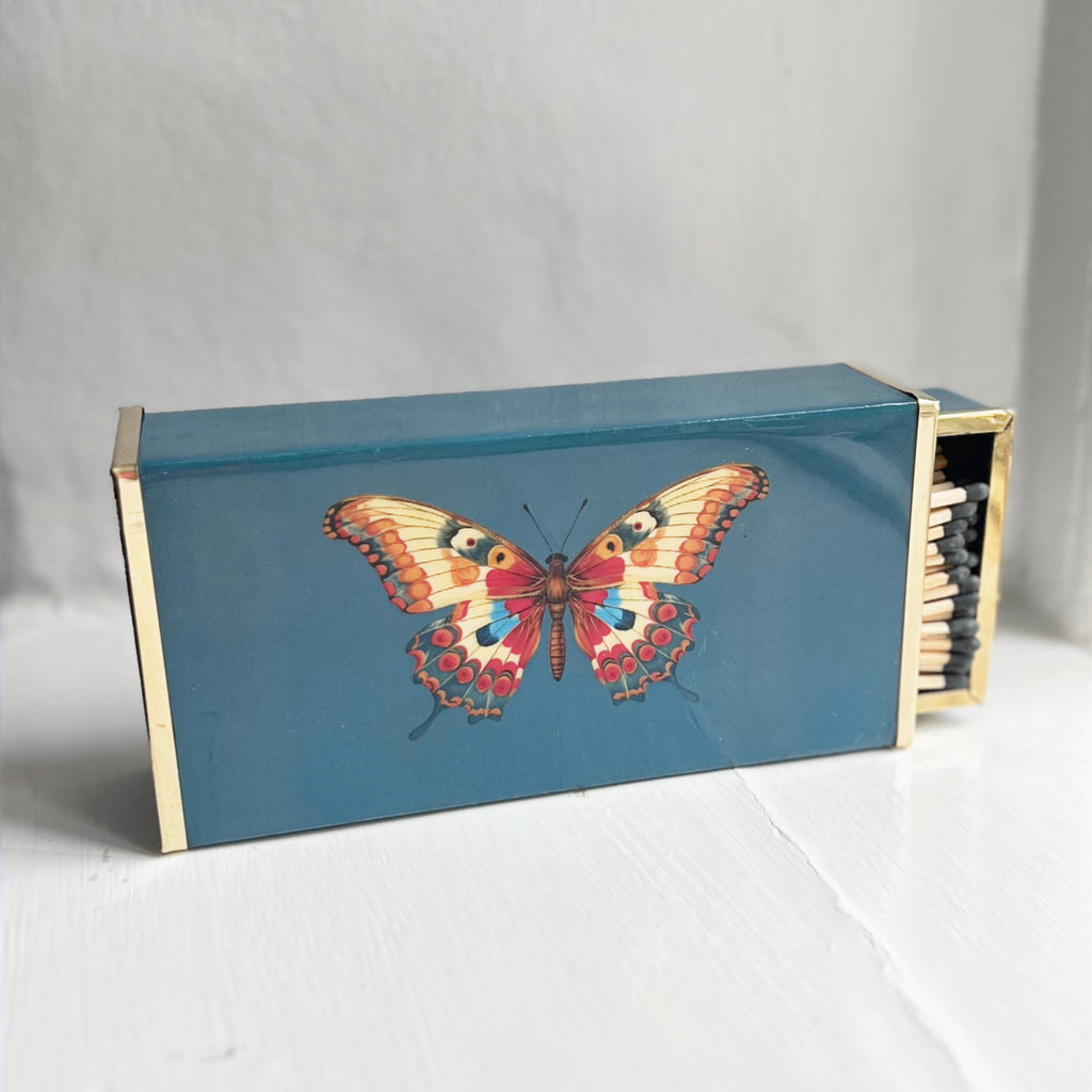 Butterfly oversized matchbox in teal enamel and brass, close-up of the design