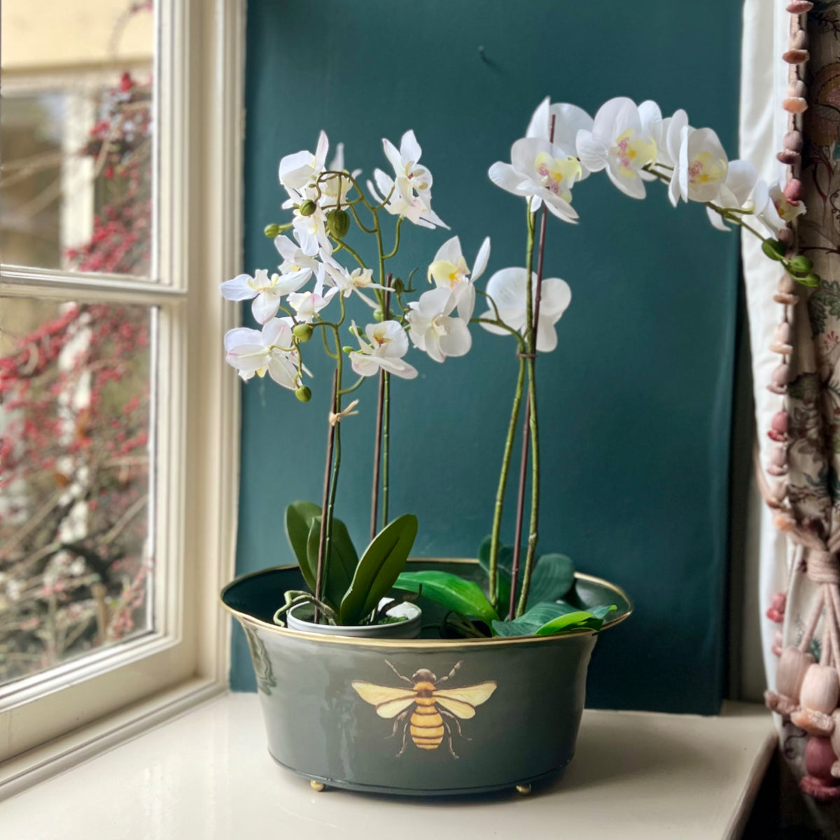 Honeybee ornamental planter in grey green with white orchids