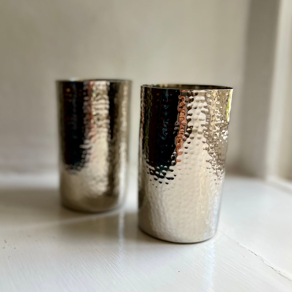 Pair of handmade hammered metal tumblers in silver
