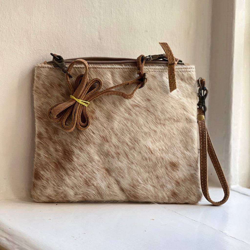 Square crossbody bag in pale cowhide with a tied leather bow