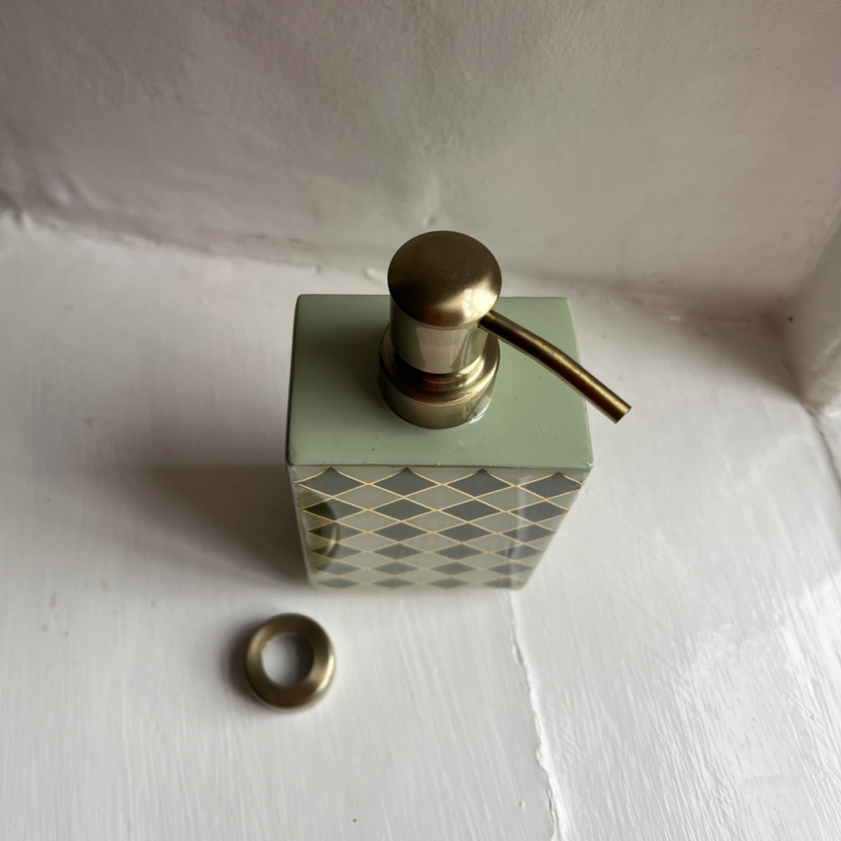 Harlequin enamel and brass multi-use bottle in Sage Green with the pump removed