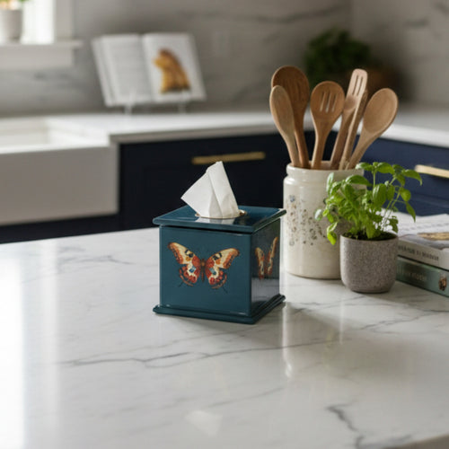 Butterfly square tissue box in teal enamel and brass on a kitchen worktop