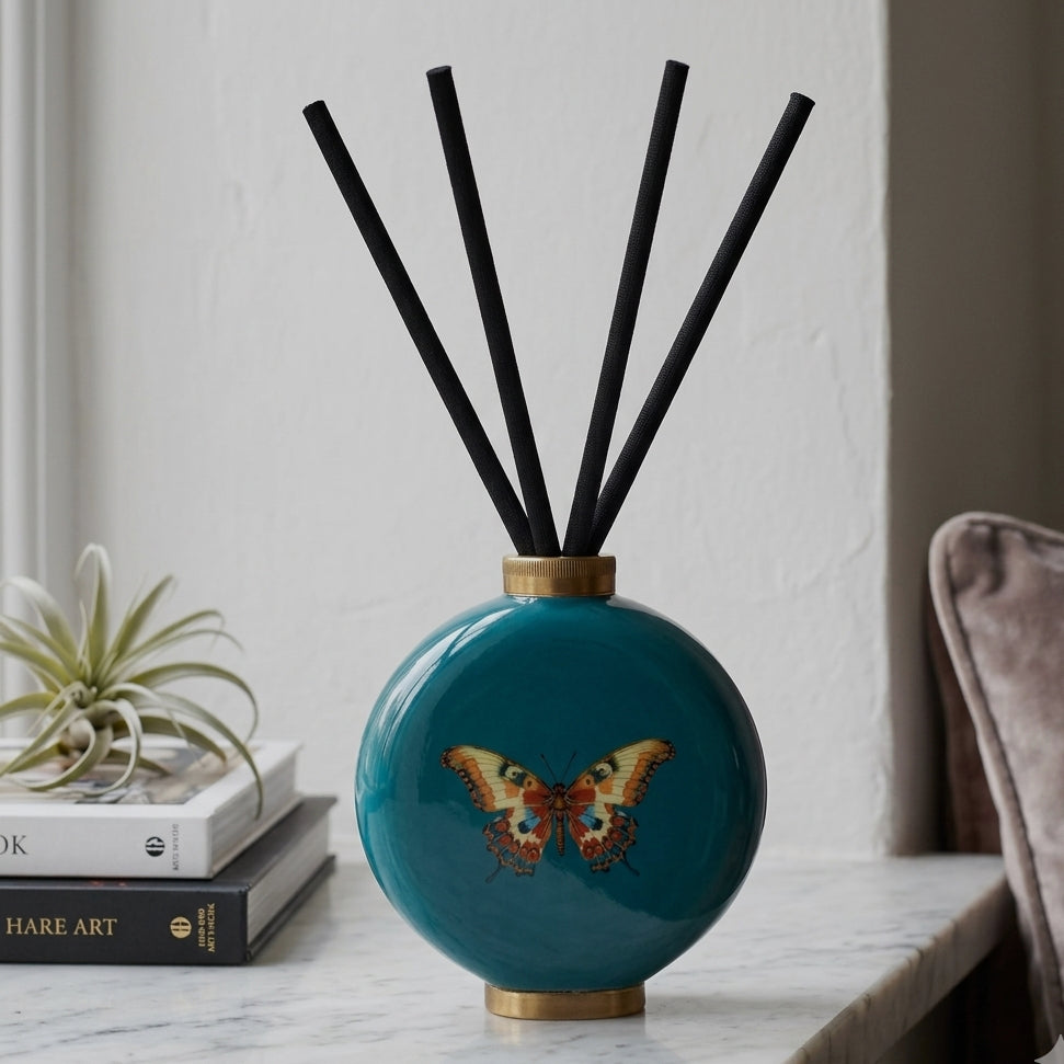 Butterfly enamel bottle used as a reed diffuser